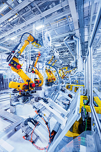 汽车厂的机器人汽车工厂的机器人手臂背景图片