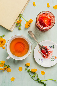 杯茶,罐子里果酱,书黄花,顶部风景图片