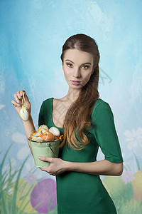 美丽,金发,清新的女人,漂亮的妆容绿色的裙子她桶复活节彩蛋图片