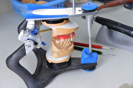 假体下巴颌骨石膏模型基本牙科工具背景