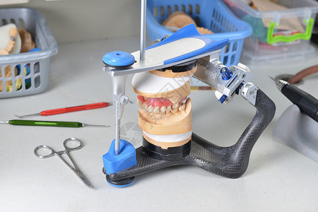 刮匙颌骨石膏模型基本牙科工具背景