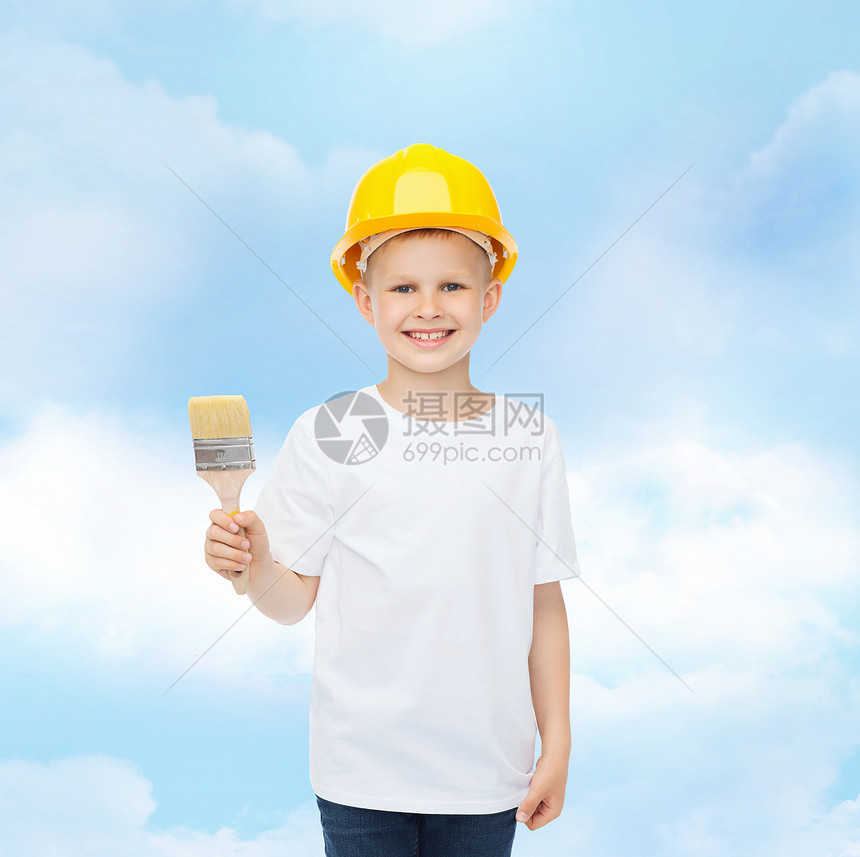 职业,未来,童人的微笑的小男孩防护头盔与油漆刷图片