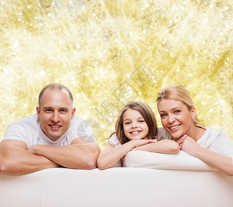 家庭,童,假期人微笑的母亲,父亲小女孩灯光背景图片