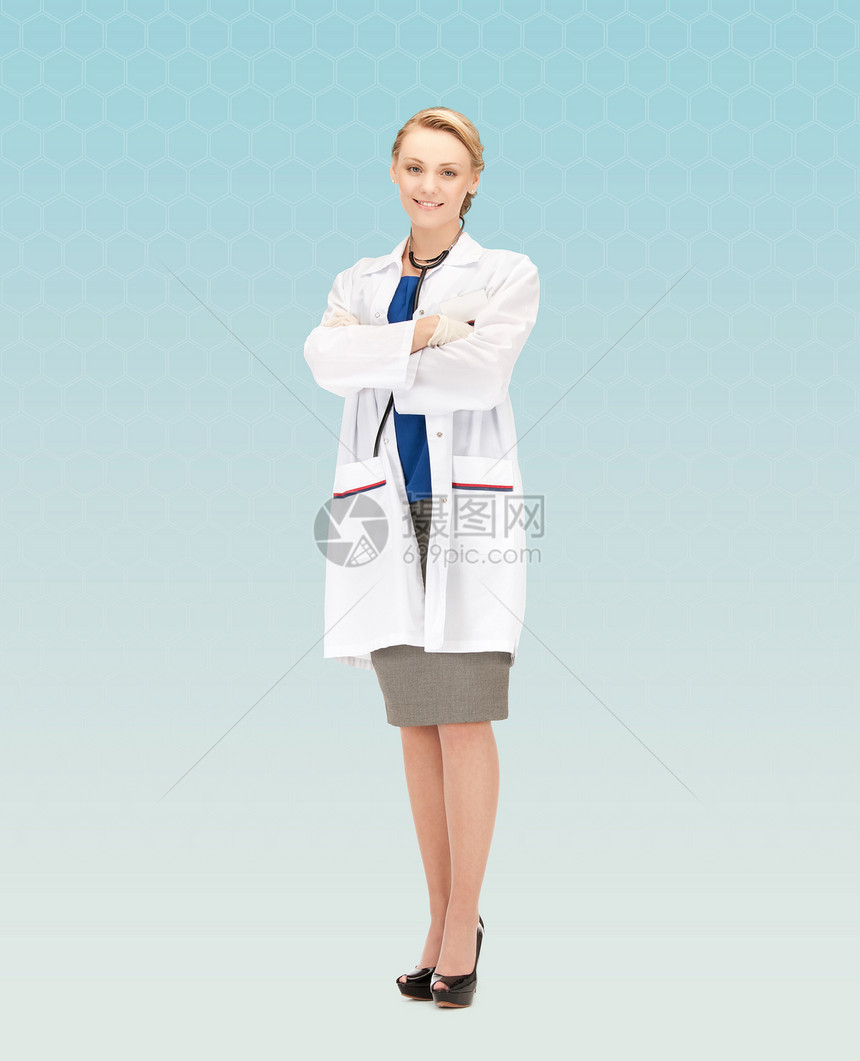 人,医学职业微笑的轻女医生蓝色背景图片