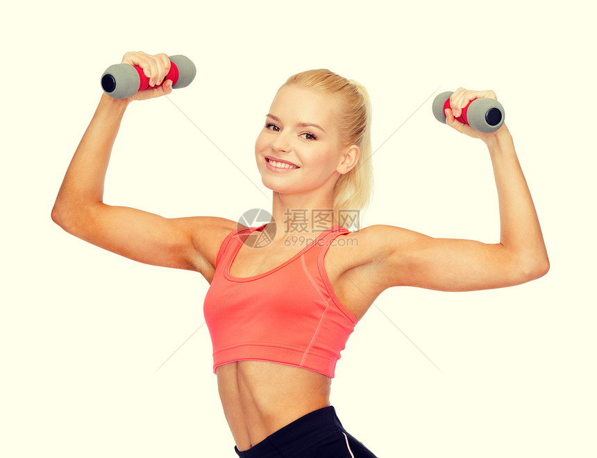 健身,运动饮食微笑美丽的运动女人与哑铃图片