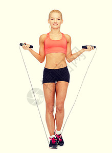 运动,锻炼保健微笑的运动妇女跳绳图片
