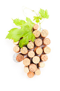 葡萄酒软木塞分离白色的葡萄形状与绿叶图片