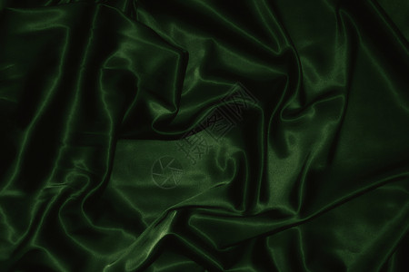 深绿色丝绸的质地背景图片