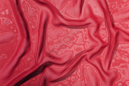 条深红色缎子丝绸的纹理特写背景图片