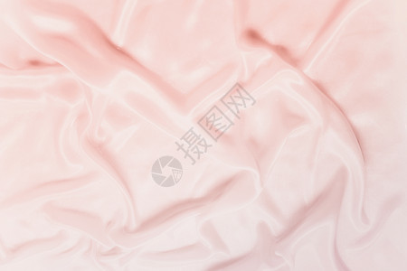 细腻的波浪,缎粉红色的丝绸,紧贴着图片