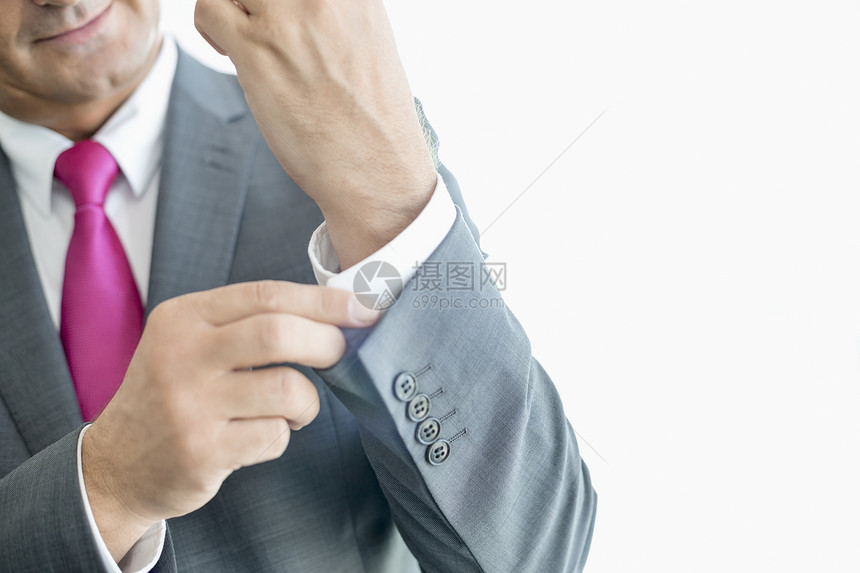 成熟商人纽扣袖子的中段图片