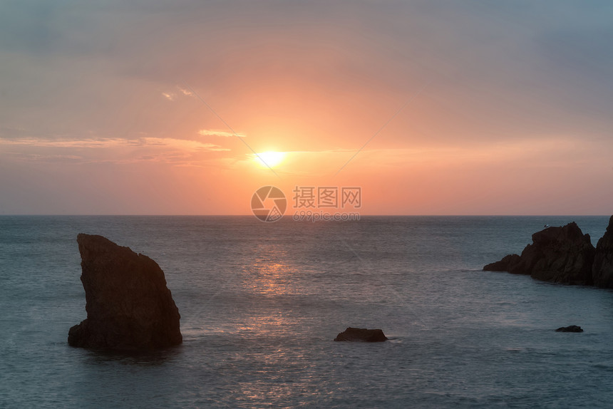 日落景观海景的岩石海岸线希望湾英国图片