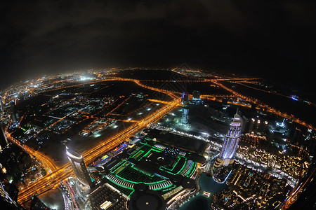 夜幕下迪拜现代城市的全景背景图片