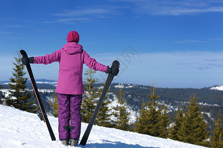 冬季妇女滑雪运动乐趣旅游雪图片