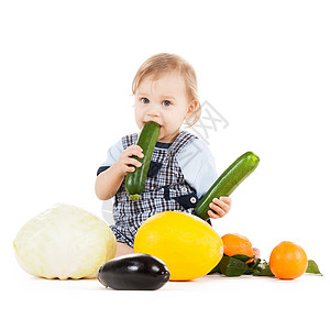女孩与小白鹿童健康的食物可爱的幼儿与蔬菜水果吃南瓜背景