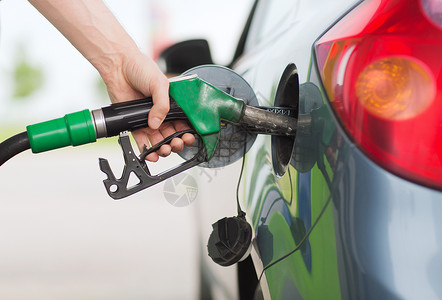 氢能燃料运输所权人加油站的汽车上泵汽油燃料背景