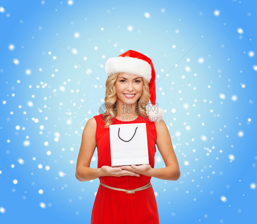 购物,销售,礼物,诞节,诞节微笑的女人穿着红色连衣裙诞老人助手帽子与购物袋图片