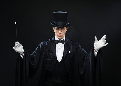 表演,马戏,表演魔术师戴着顶帽子,魔杖表演魔术图片
