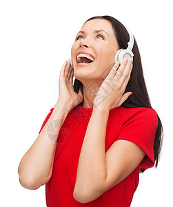 音乐技术带着耳机笑的轻女人图片