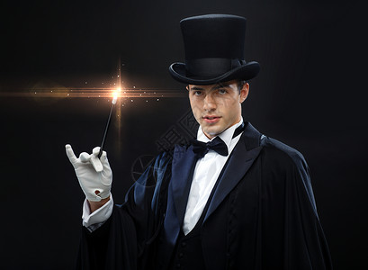 表演,马戏,表演魔术师戴着顶帽子,魔杖表演魔术人高清图片素材