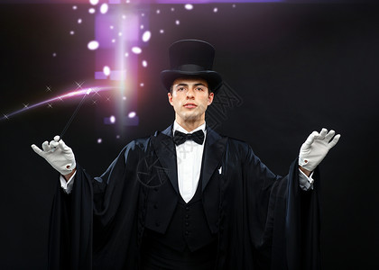 表演,马戏,表演魔术师戴着顶帽子,魔杖表演魔术制作高清图片素材