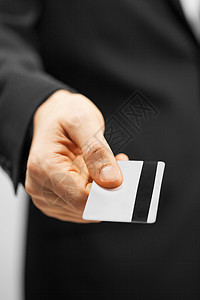 会员特权穿着西装的人着信用卡的照片背景