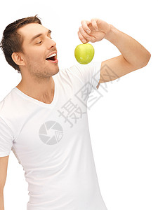 穿着白色衬衫绿色苹果的英俊男人高清图片