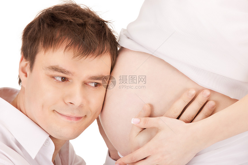 男部孕妇腹部的明亮特写照片图片