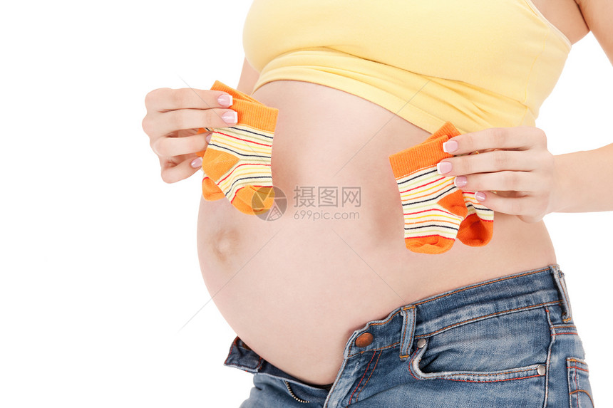 美丽的孕妇肚子双袜子的照片图片