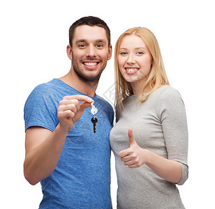 房地产,家庭,手势夫妇的微笑的夫妇着钥匙竖大拇指图片