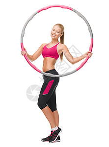 健身,运动保健轻的运动妇女与呼啦圈背景图片