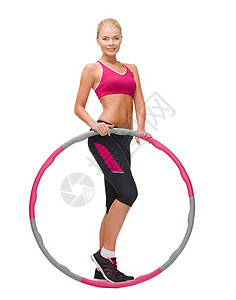 健身,运动保健轻的运动妇女与呼啦圈背景图片