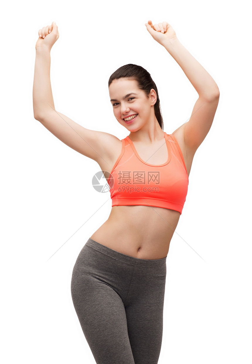 健身饮食微笑的十几岁女孩穿着运动服跳舞图片