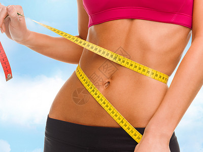 运动,健身饮食用测量带靠近训练素的腹部图片