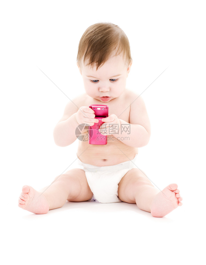 带粉红色手机的婴儿尿布照片图片