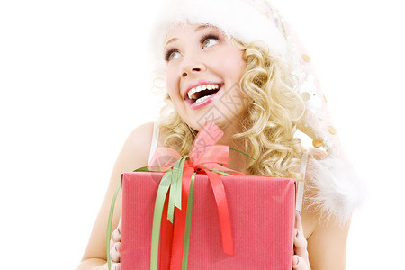 带礼品盒的快乐圣诞老人帮女孩的照片图片