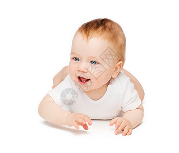 孩子蹒跚学步的微笑的婴儿躺地板上图片