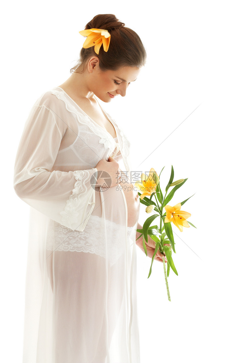美丽的孕妇,百合花超过白色图片