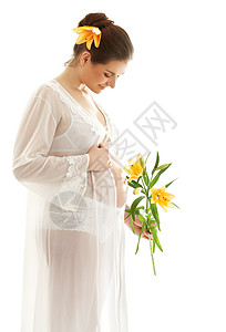 美丽的孕妇,百合花超过白色图片