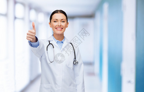 保健医学微笑的女医生,听诊器大拇指图片