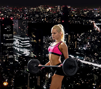 健身,运动节食的运动的女人用杠铃锻炼图片