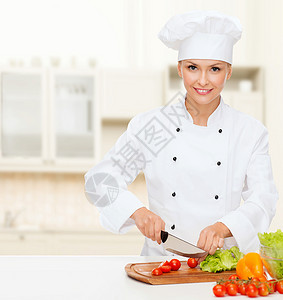 烹饪食物微笑的女厨师,厨师包师切蔬菜图片