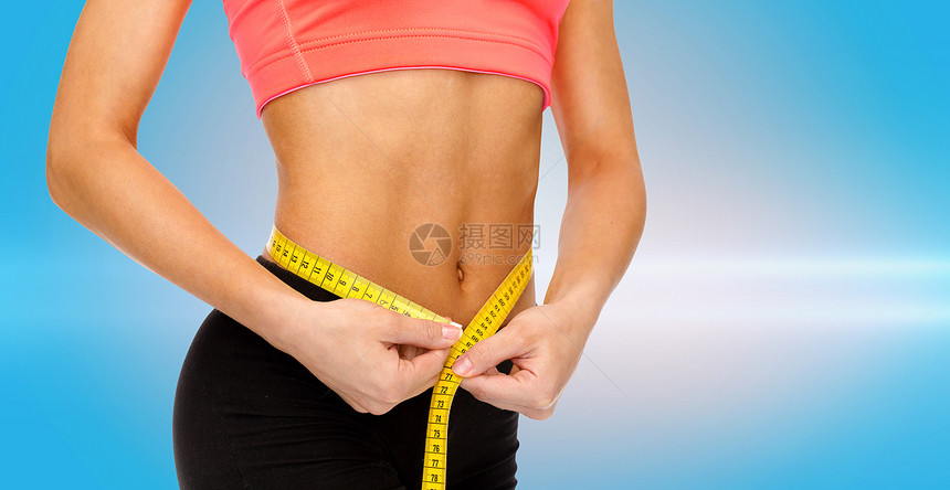 饮食,运动,健身健康的用测量带靠近女的手测量腰部图片