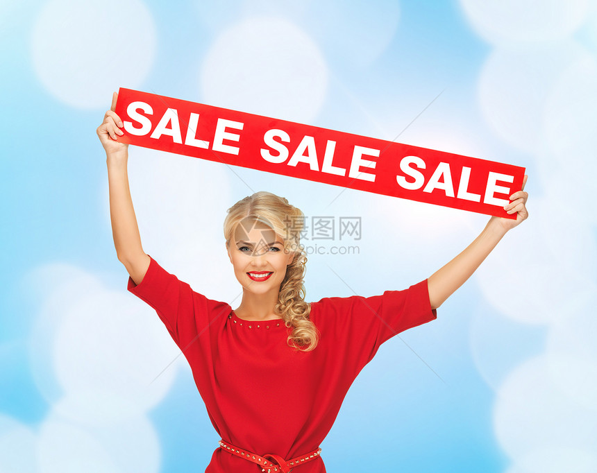 销售,购物,诞节,假日人们的微笑的女人穿着红色的衣服,红色的销售标志蓝色的灯光背景图片