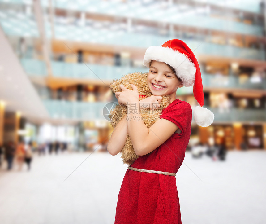节日,礼物,诞节,童人的微笑的女孩诞老人帮助帽子与泰迪熊购物中心的背景图片
