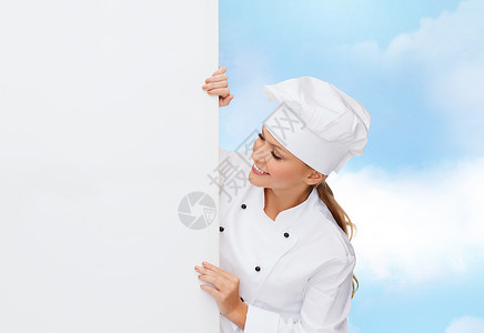 烹饪,广告食品微笑的女厨师,厨师包师与白色空白板图片