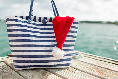 海滩,夏天,假期,诞节配件海滩袋诞老人助手帽子木墩图片
