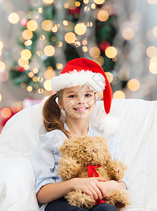 假期,礼物,童人的微笑的小女孩与泰迪熊玩具客厅诞树的背景图片