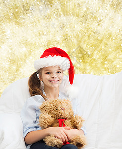 节日,礼物,诞节,童人的微笑的小女孩与泰迪熊玩具灯光背景图片