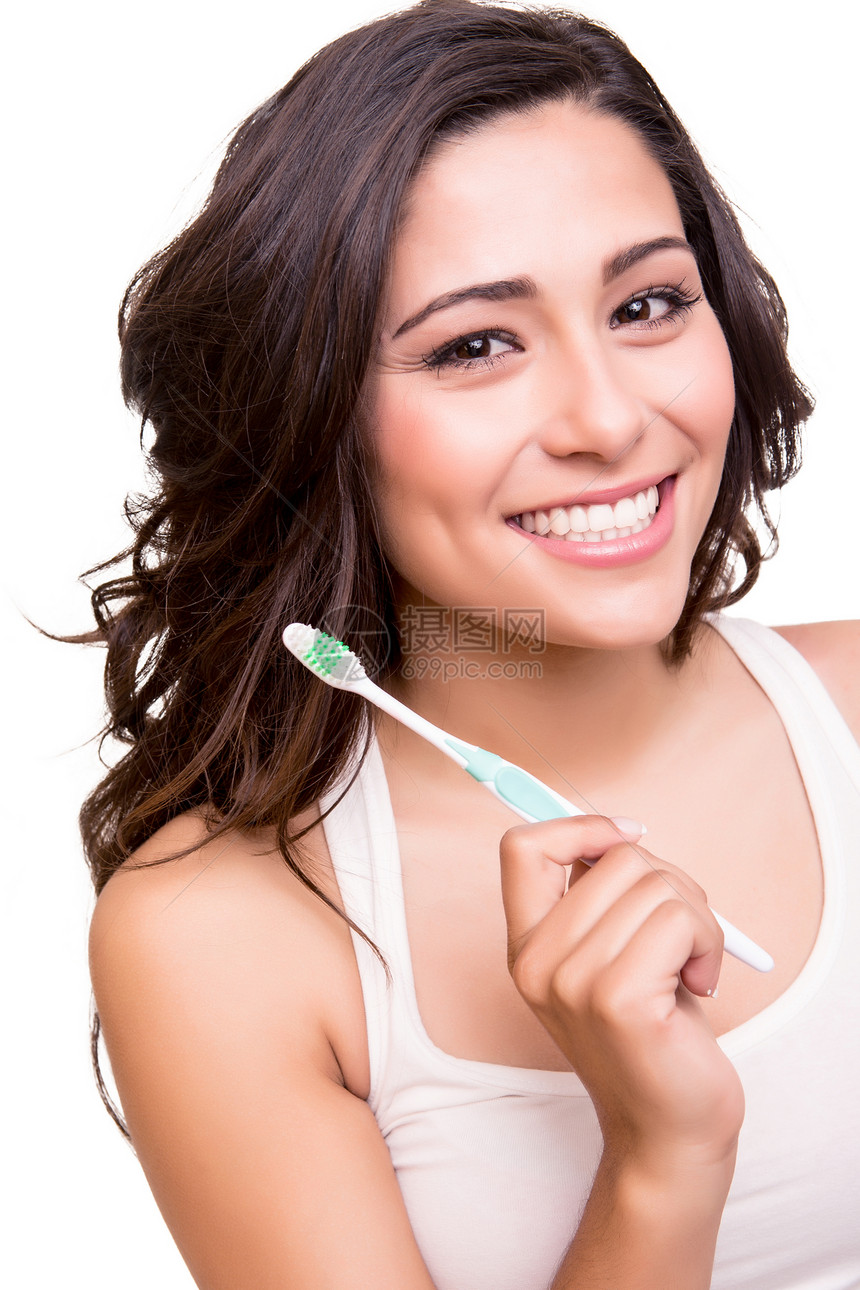 微笑的轻女人,健康的牙齿,着牙刷图片